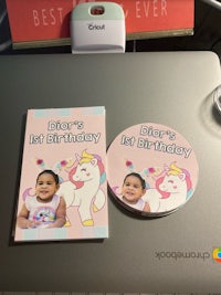 a laptop with a photo of a unicorn and a birthday cd